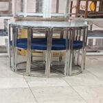 Small oval metal dining table for 6 people